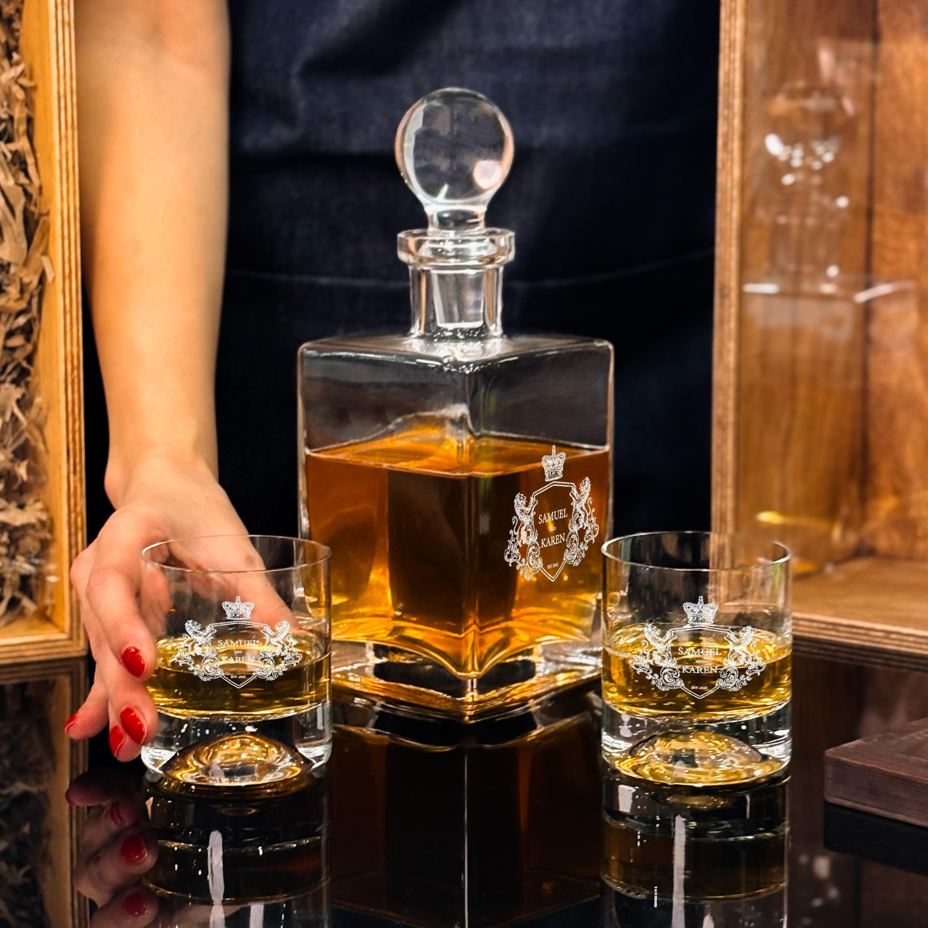 Custom engraved whiskey glasses and decanter set styled as an elegant gift with wood box option