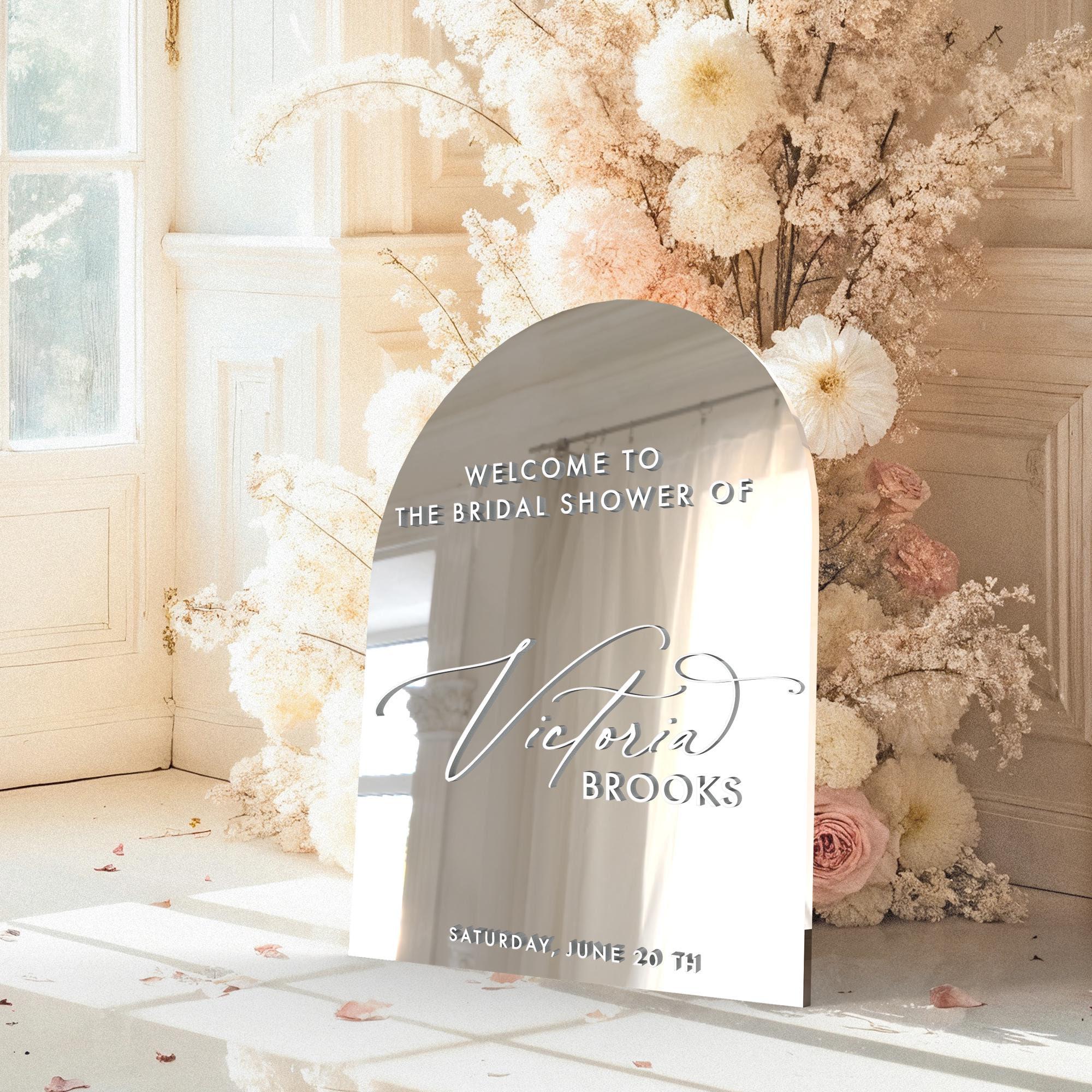 Acrylic bridal shower welcome sign in gold mirror finish styled at the event entrance for bridal shower decor