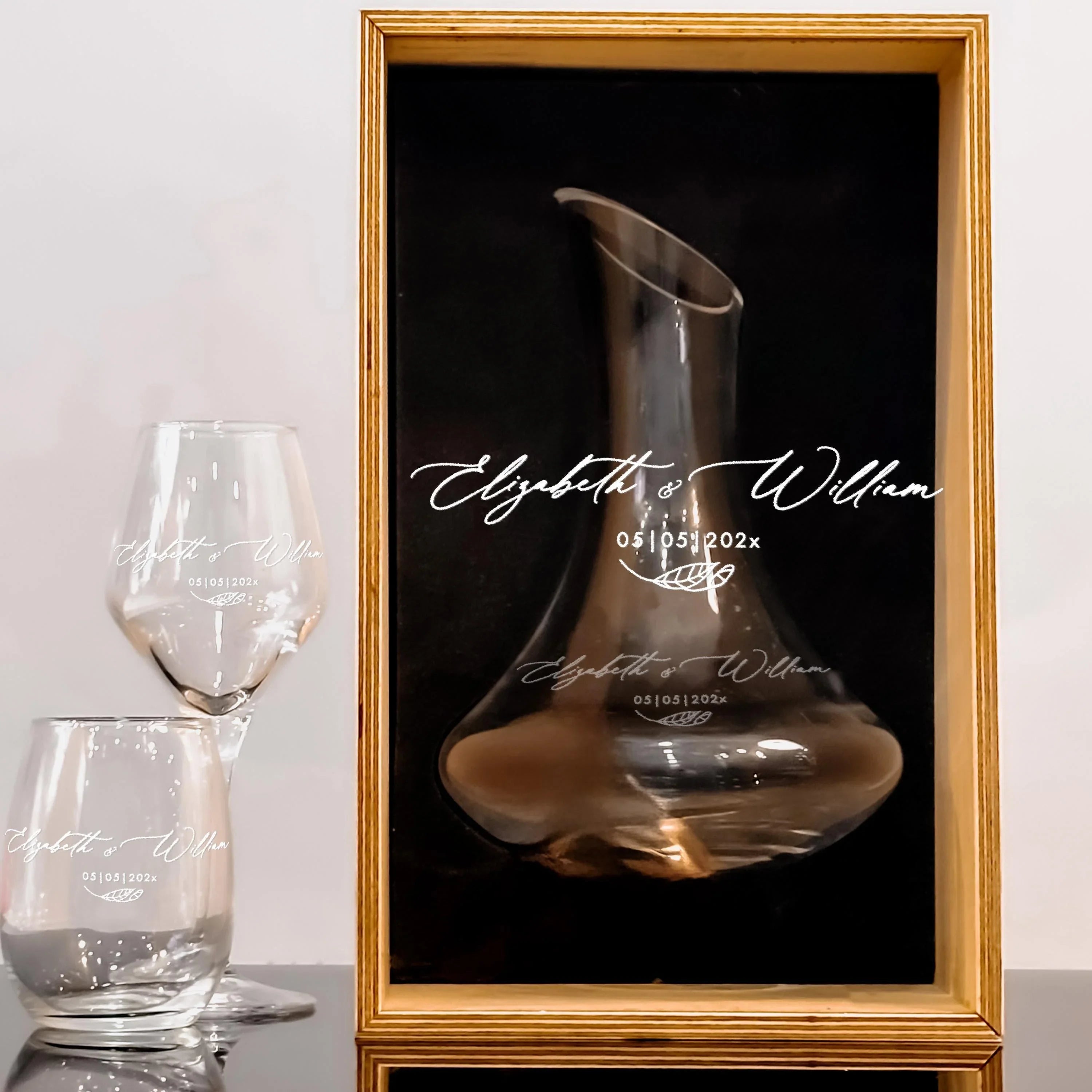 Custom engraved wedding wine glasses and decanter set styled as an elegant gift with wood box option