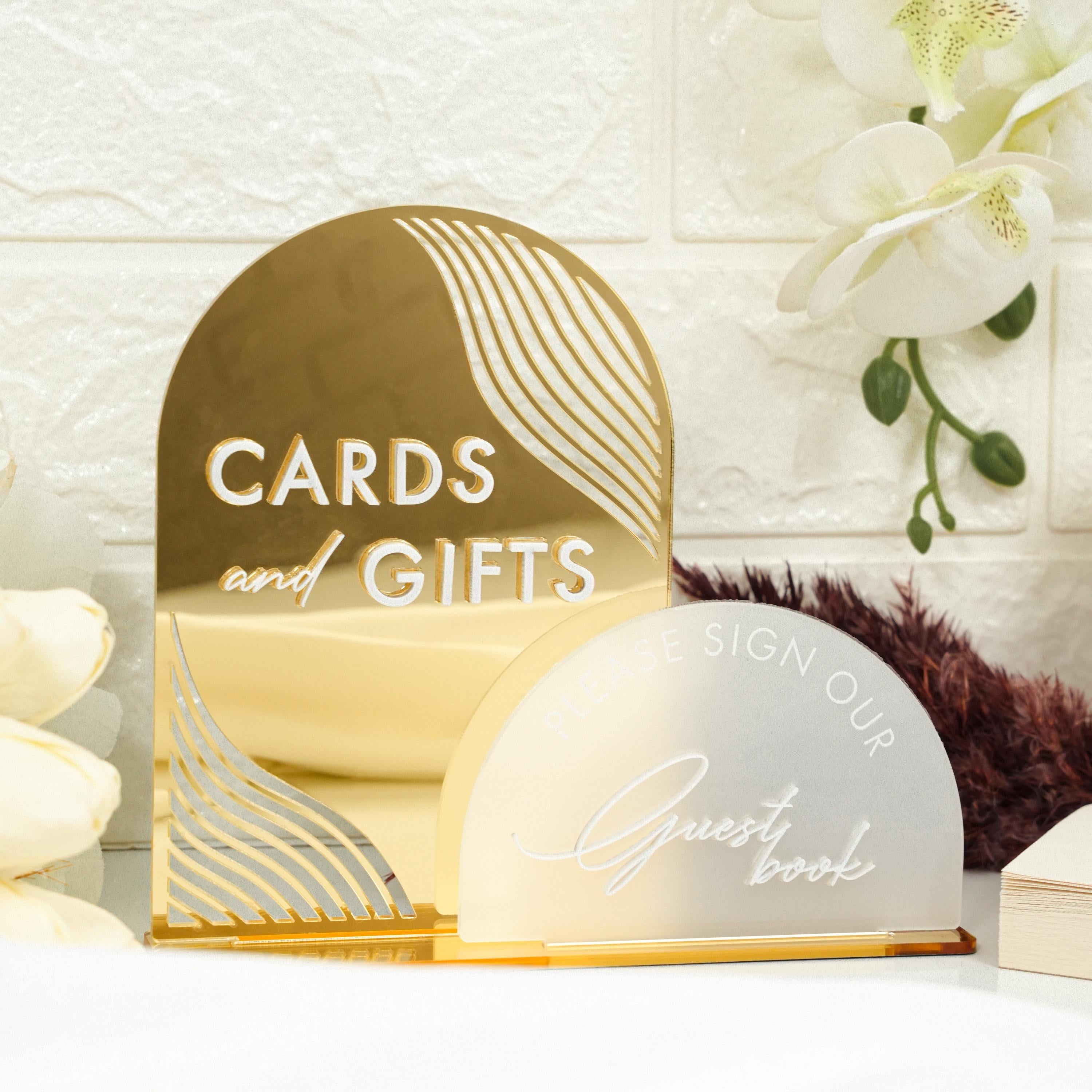 a couple of cards and gifts sitting on a table