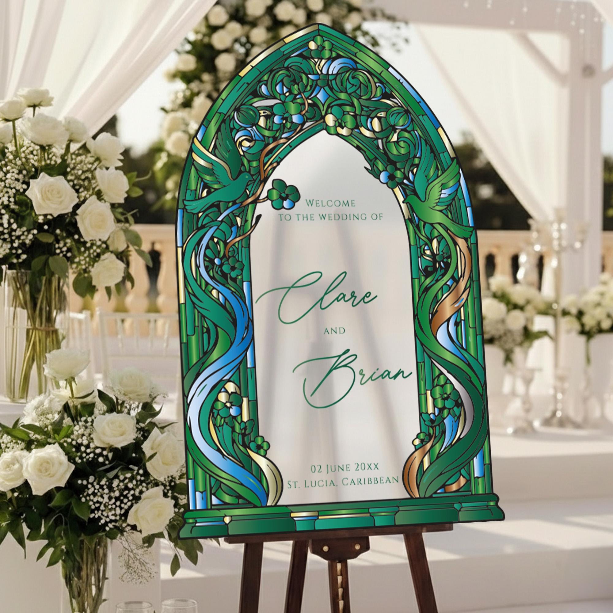 a wedding invitation with a green and white color scheme, displayed on a stand in a garden setting.