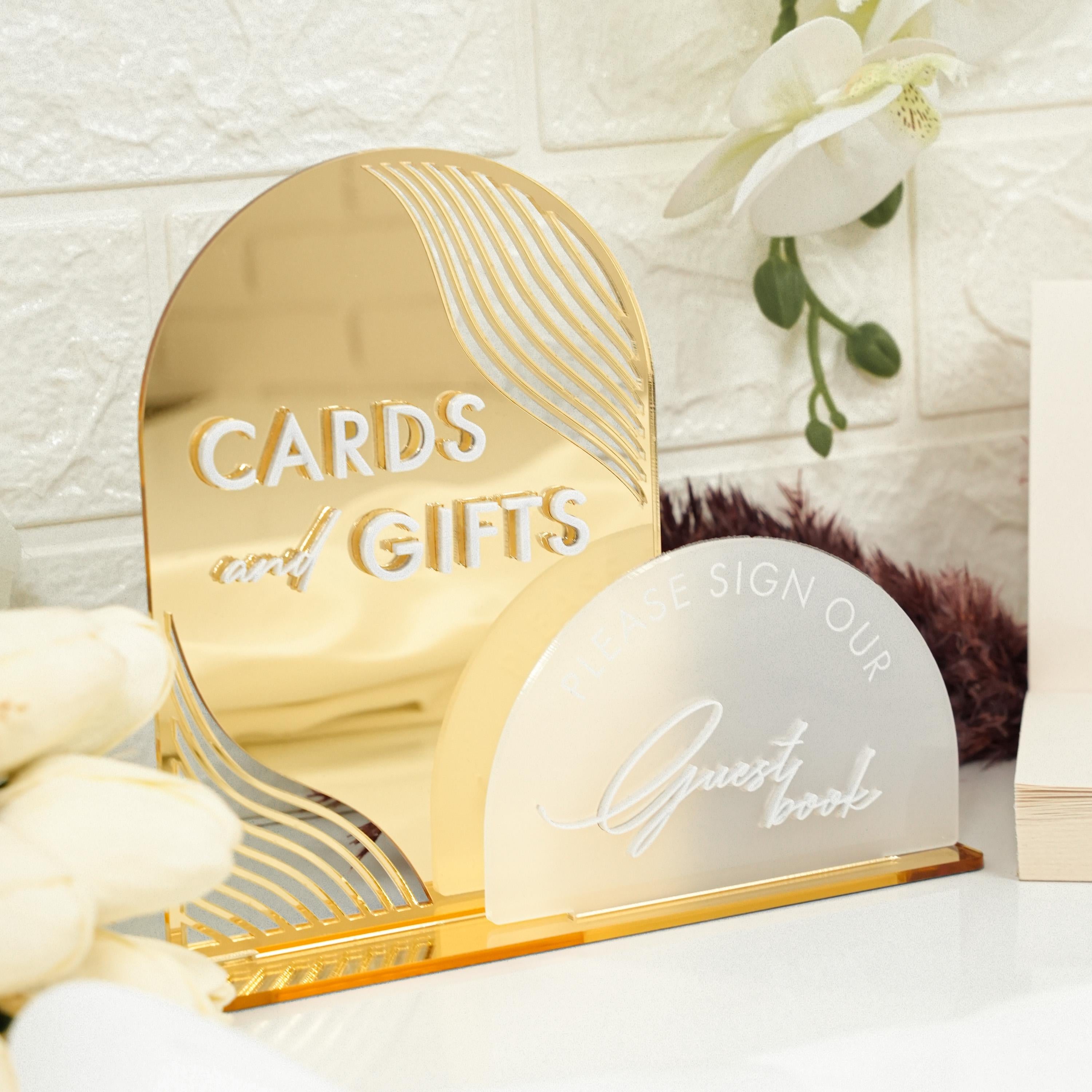 a couple of cards and a mirror on a table