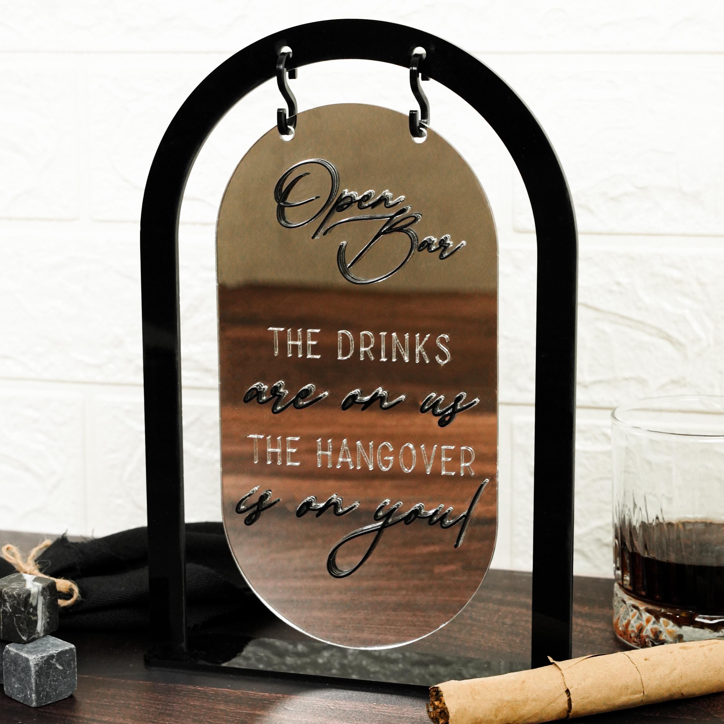 a wine glass with a wine bottle next to it