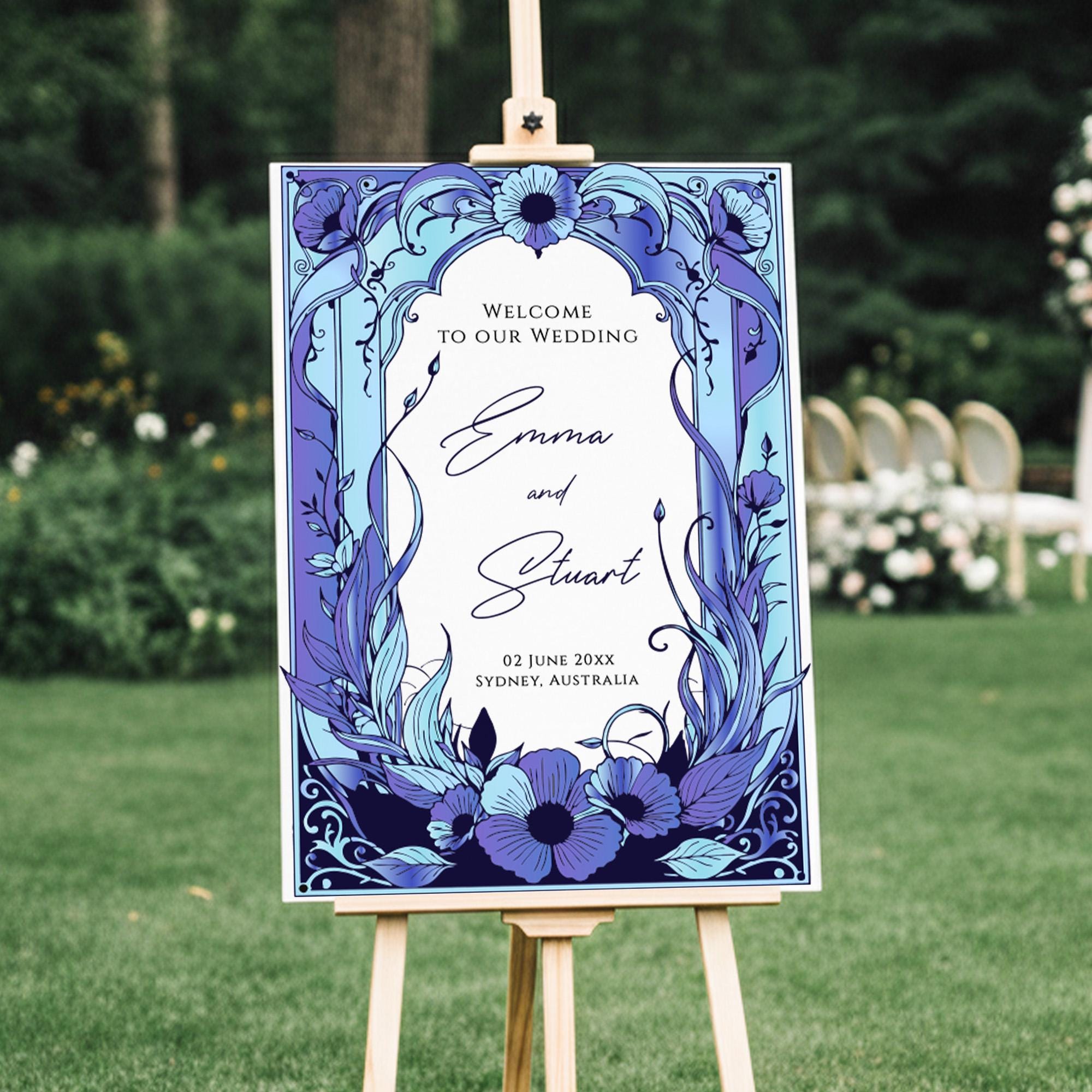 A wedding invitation sign with a floral design and text welcoming guests to the wedding of Emma and Stuart.