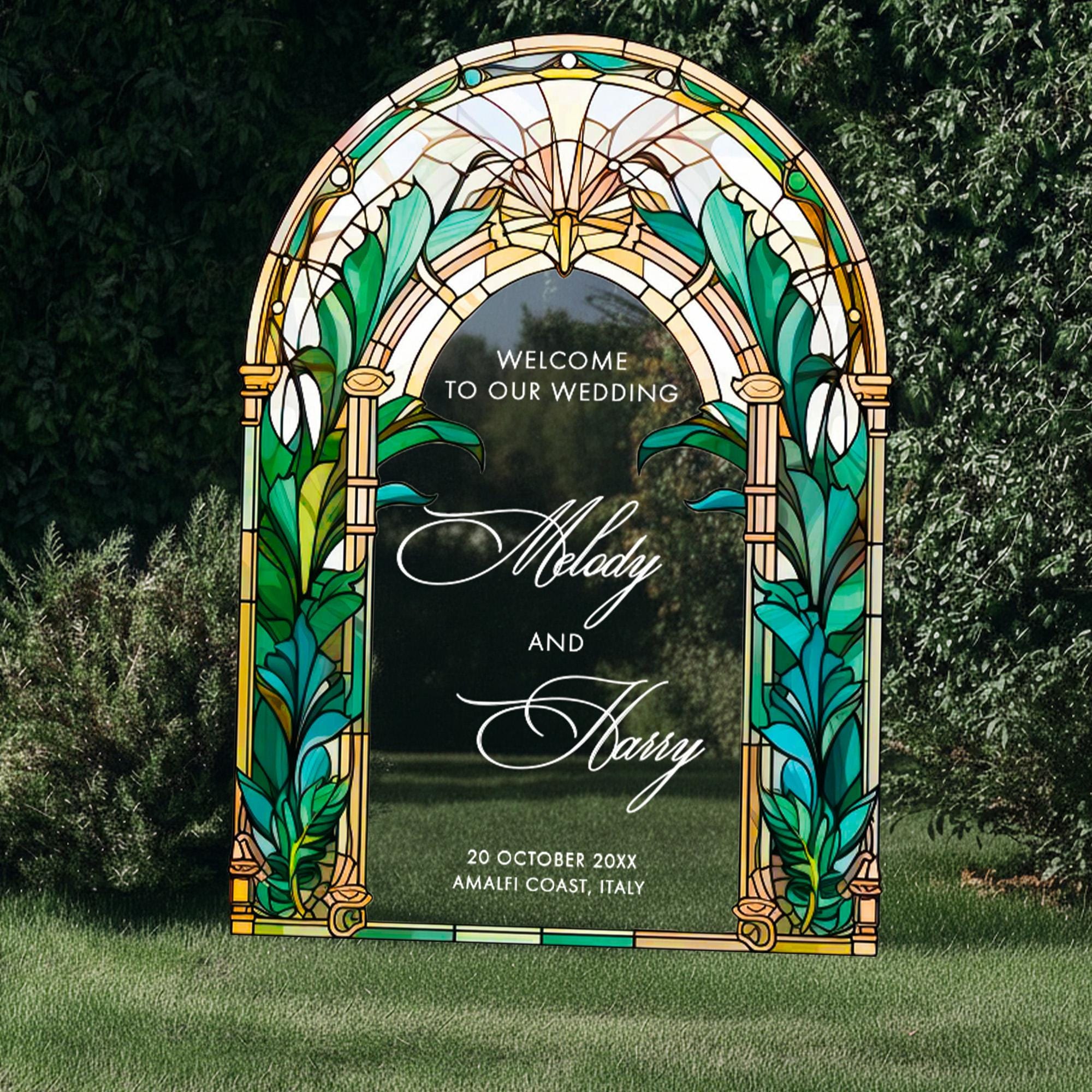 a large, colorful stained glass archway with the text "Welcome to our wedding" displayed on it.