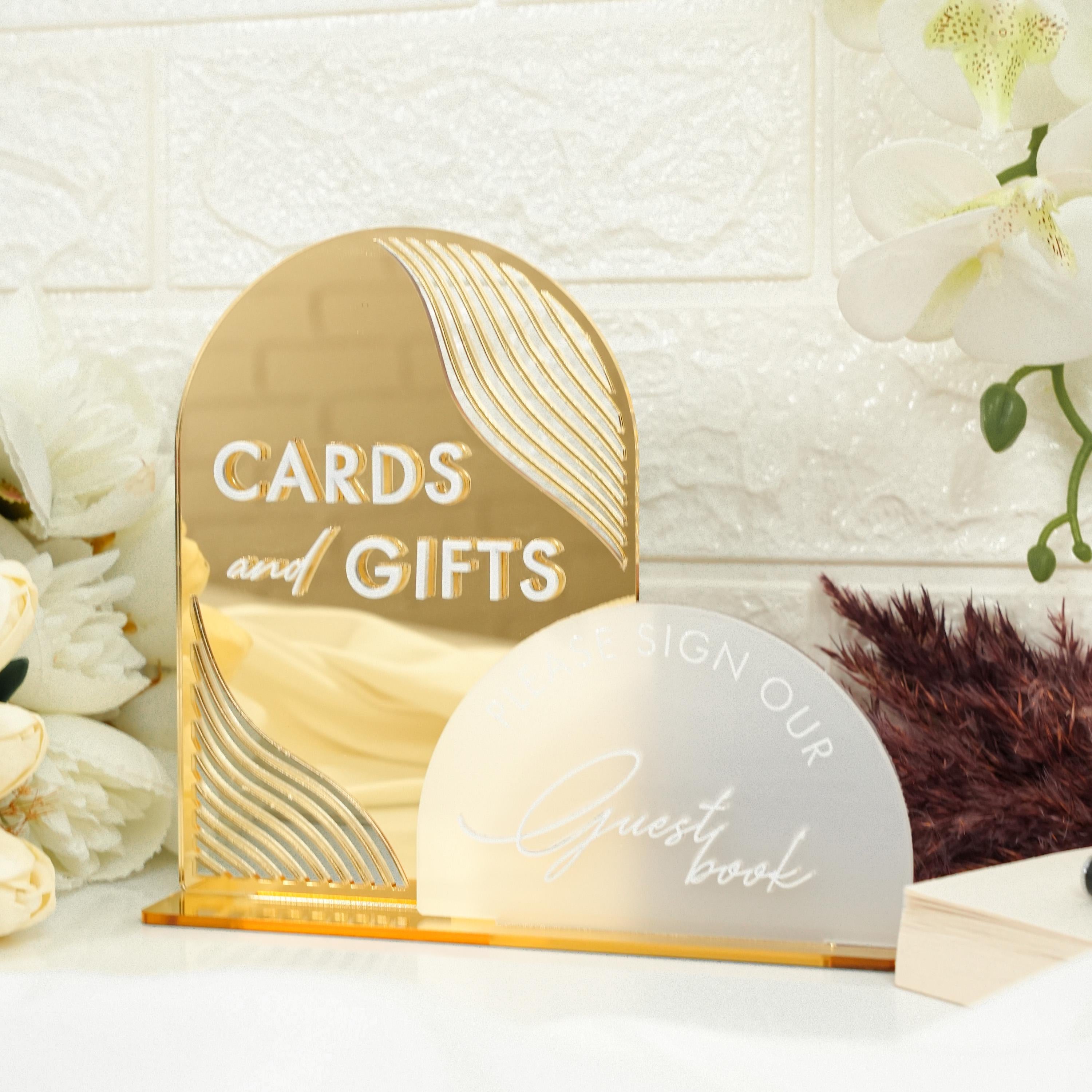 a couple of cards and gifts sitting on a table