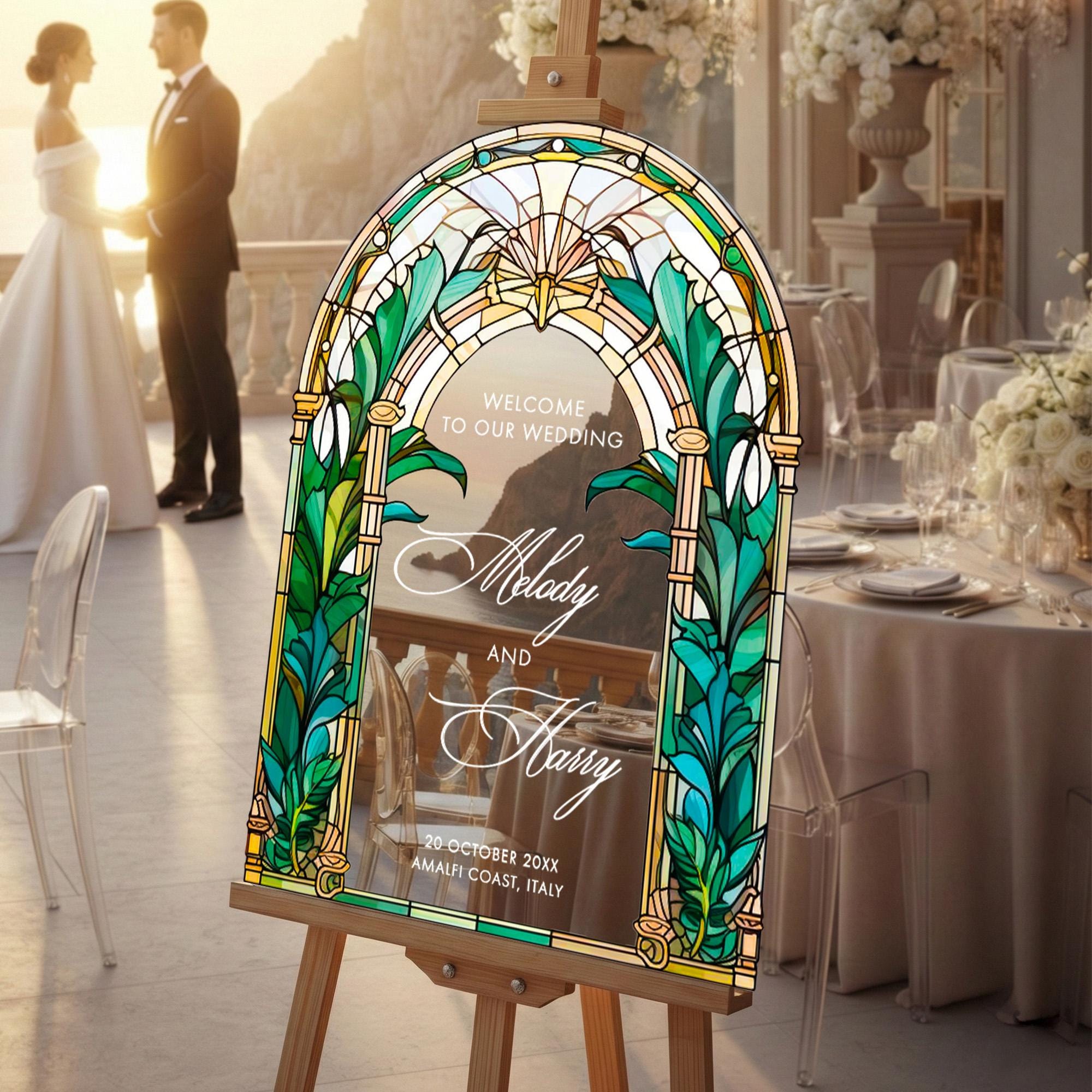 a wedding invitation sign with a stained glass design, placed in a setting with a couple standing in the background.