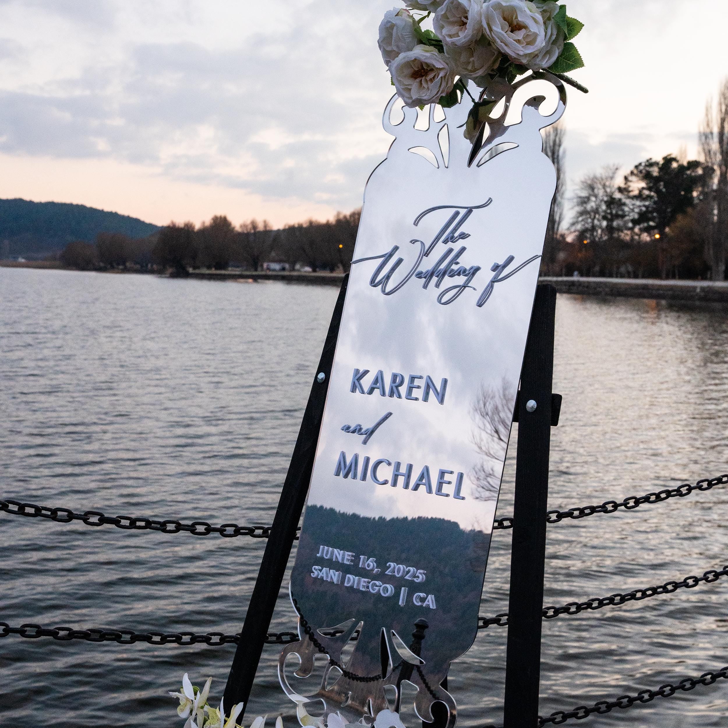 Elegant silver mirror acrylic wedding welcome sign with intricate cutout details and sophisticated 3D lettering. Featuring the couple’s names and wedding date, this modern and luxurious design adds a timeless and stylish touch to any wedding entrance.