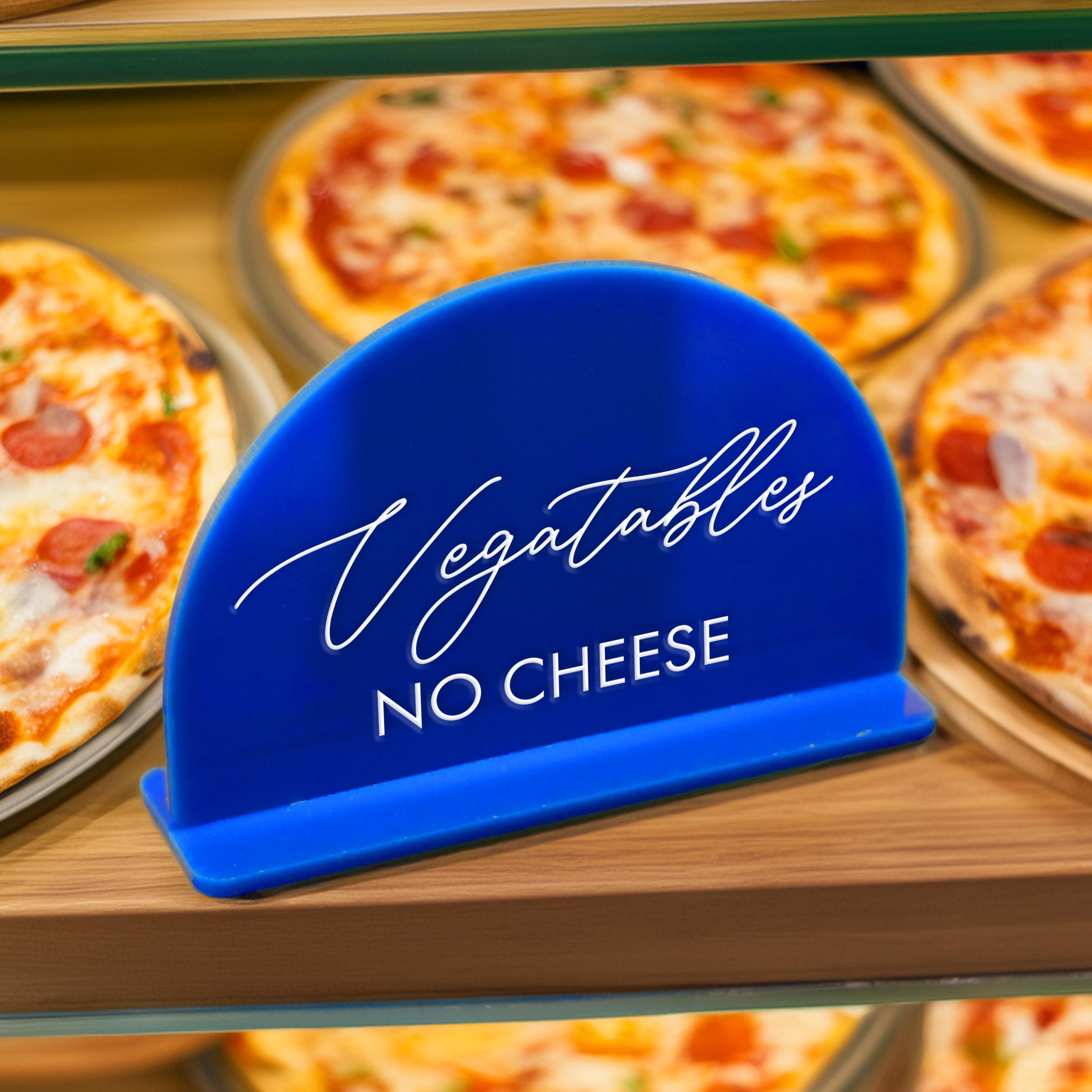 a display of pizzas with a blue hat on top of it