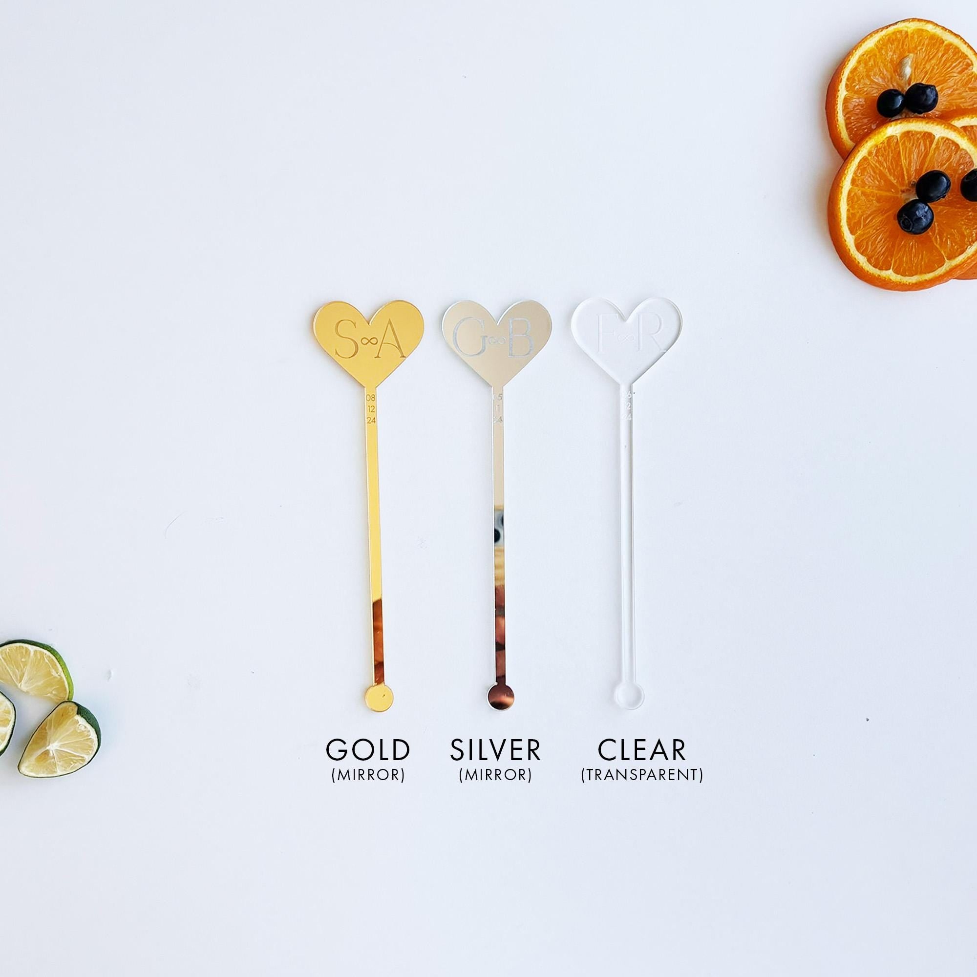 a white table topped with orange slices and spoons