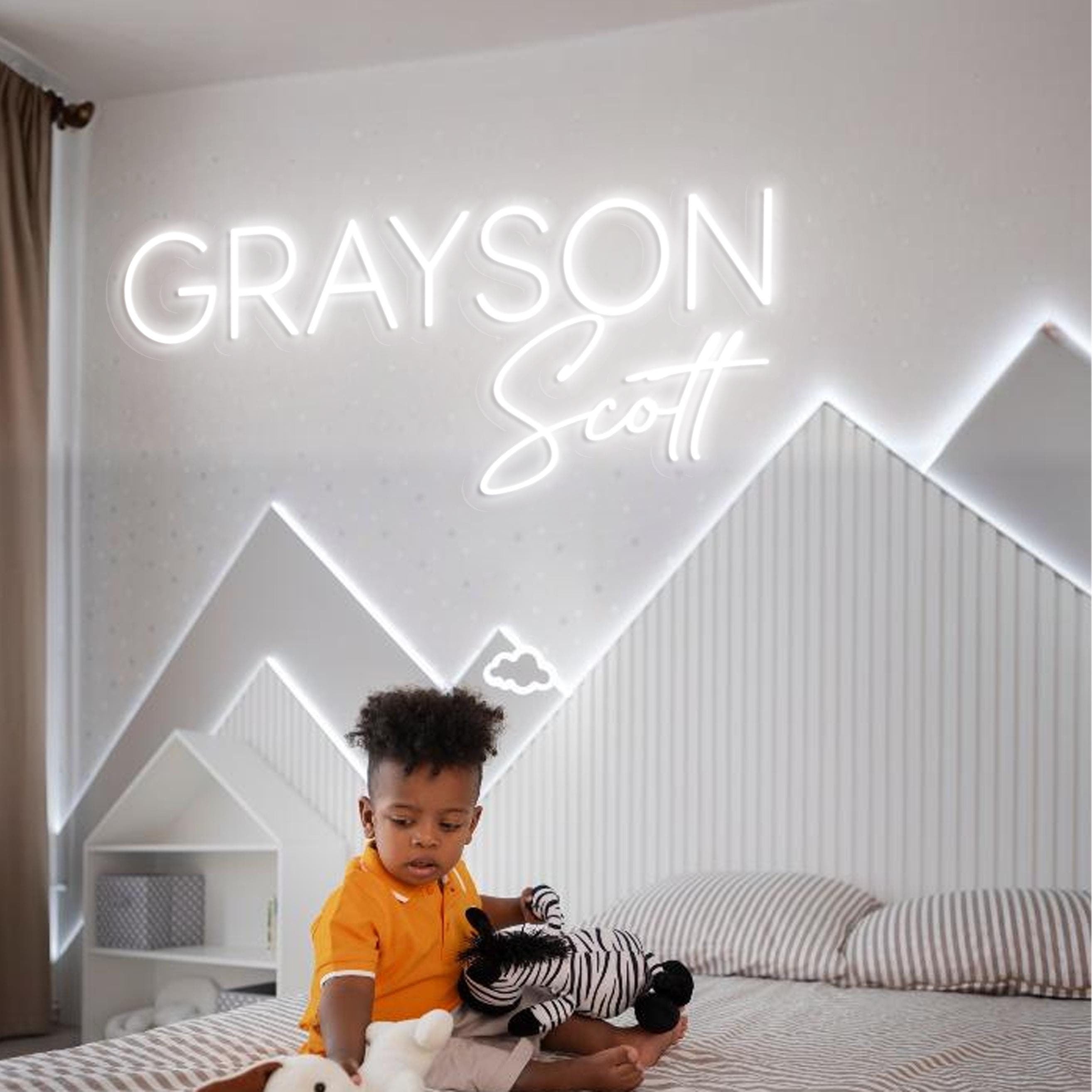 Modern kid's bedroom featuring a personalized neon  wall sign with 3D Neon name sign and geometric mountain-themed wall design.