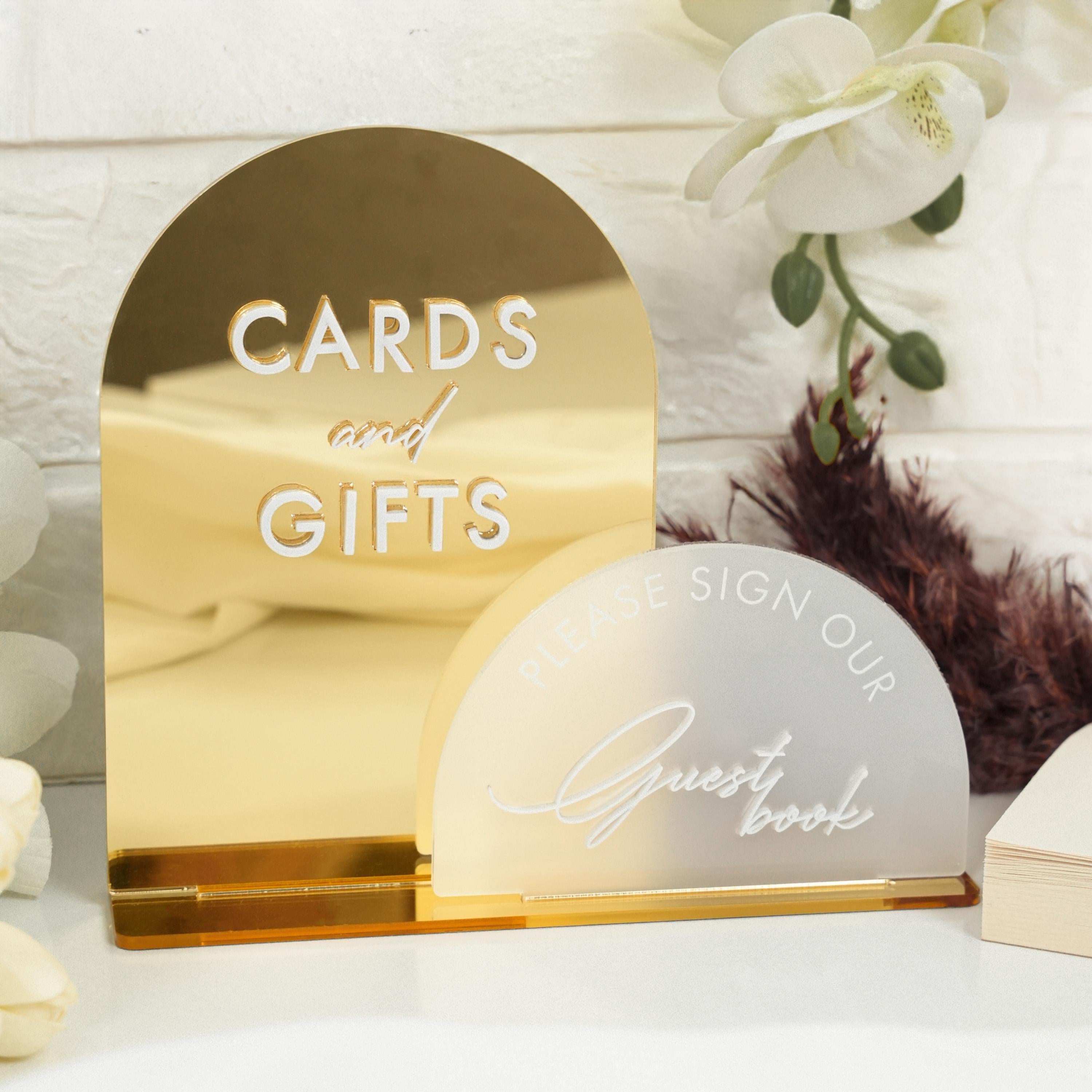 a couple of cards and gifts sitting on a table