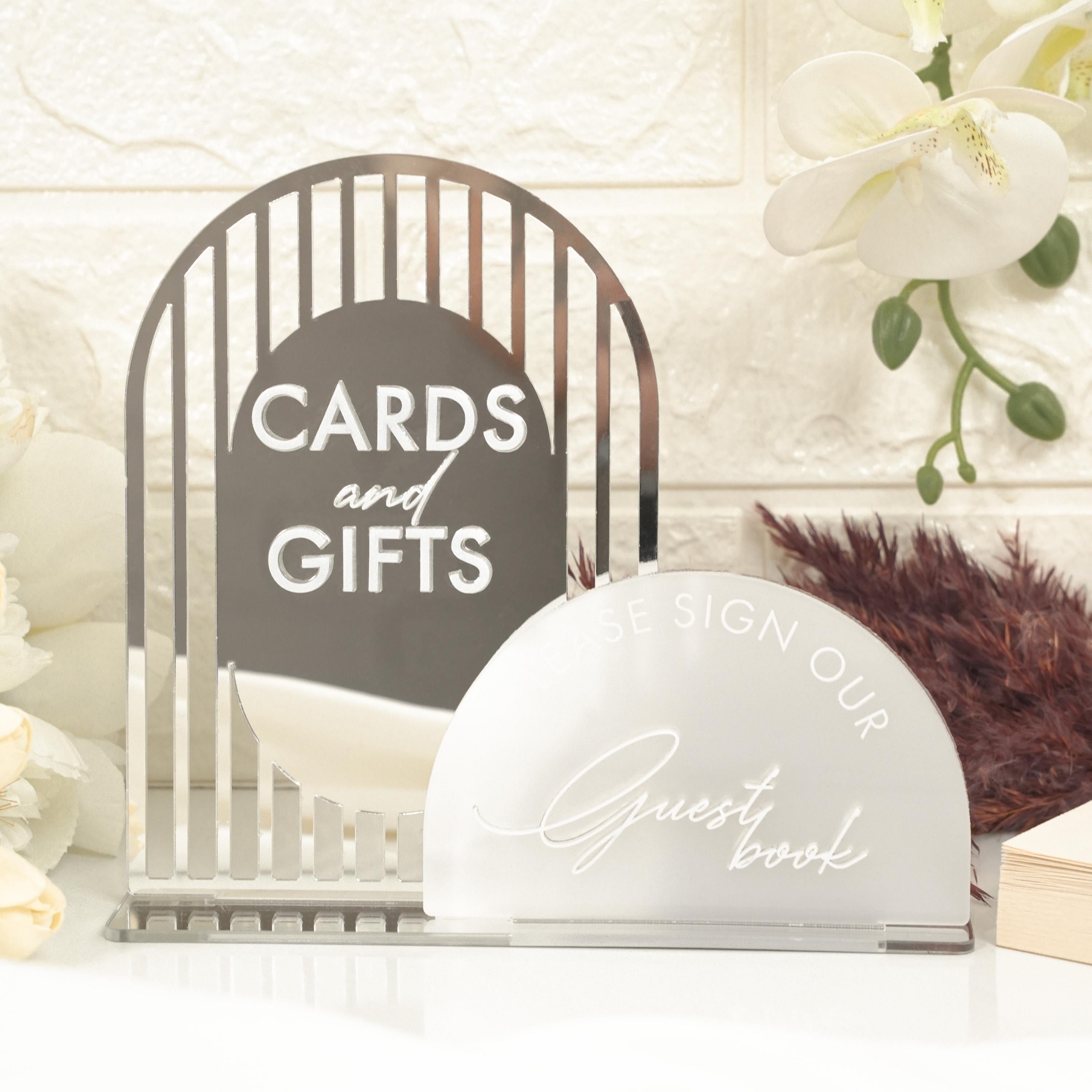 a couple of cards and gifts sitting on a table