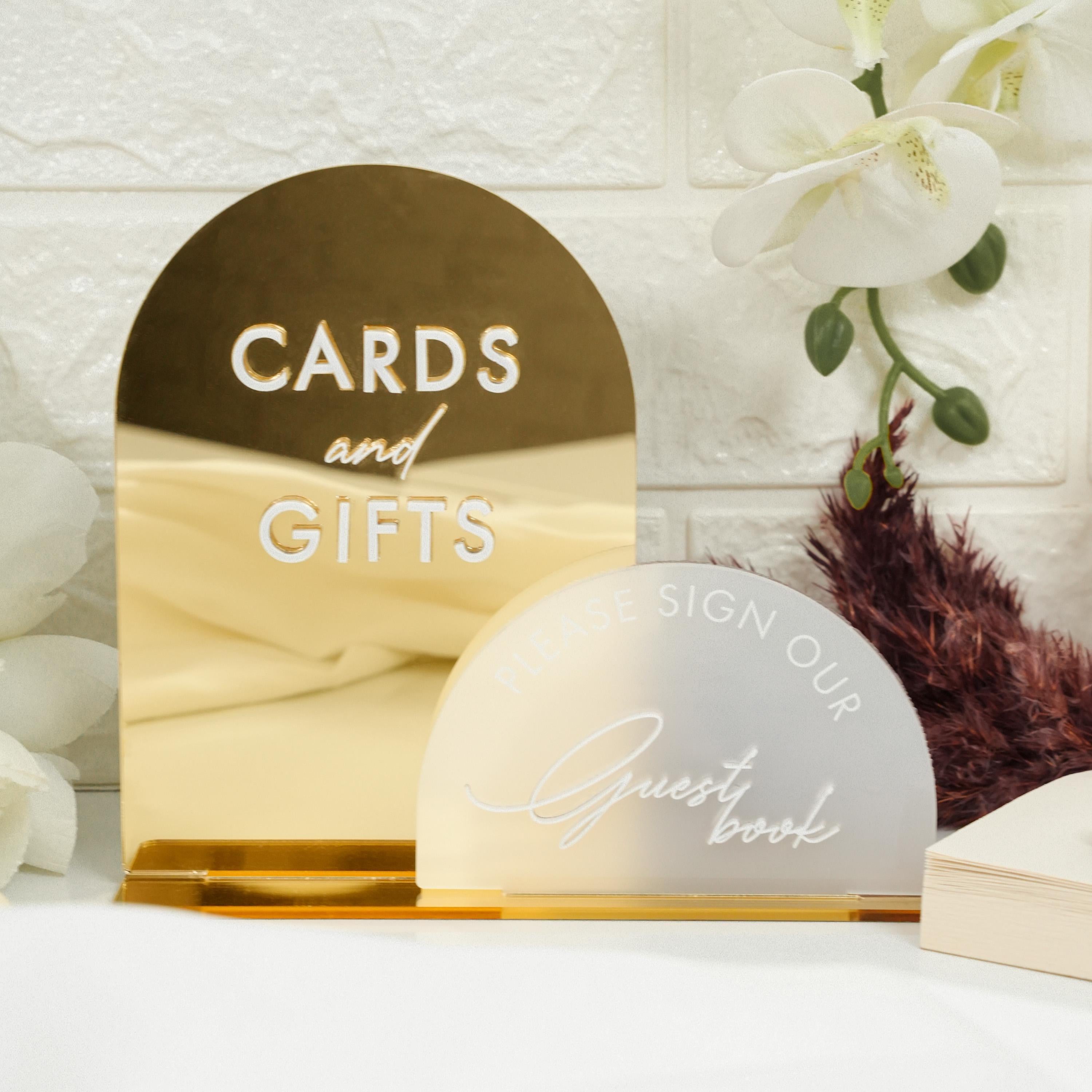 a couple of cards and gifts sitting on a table