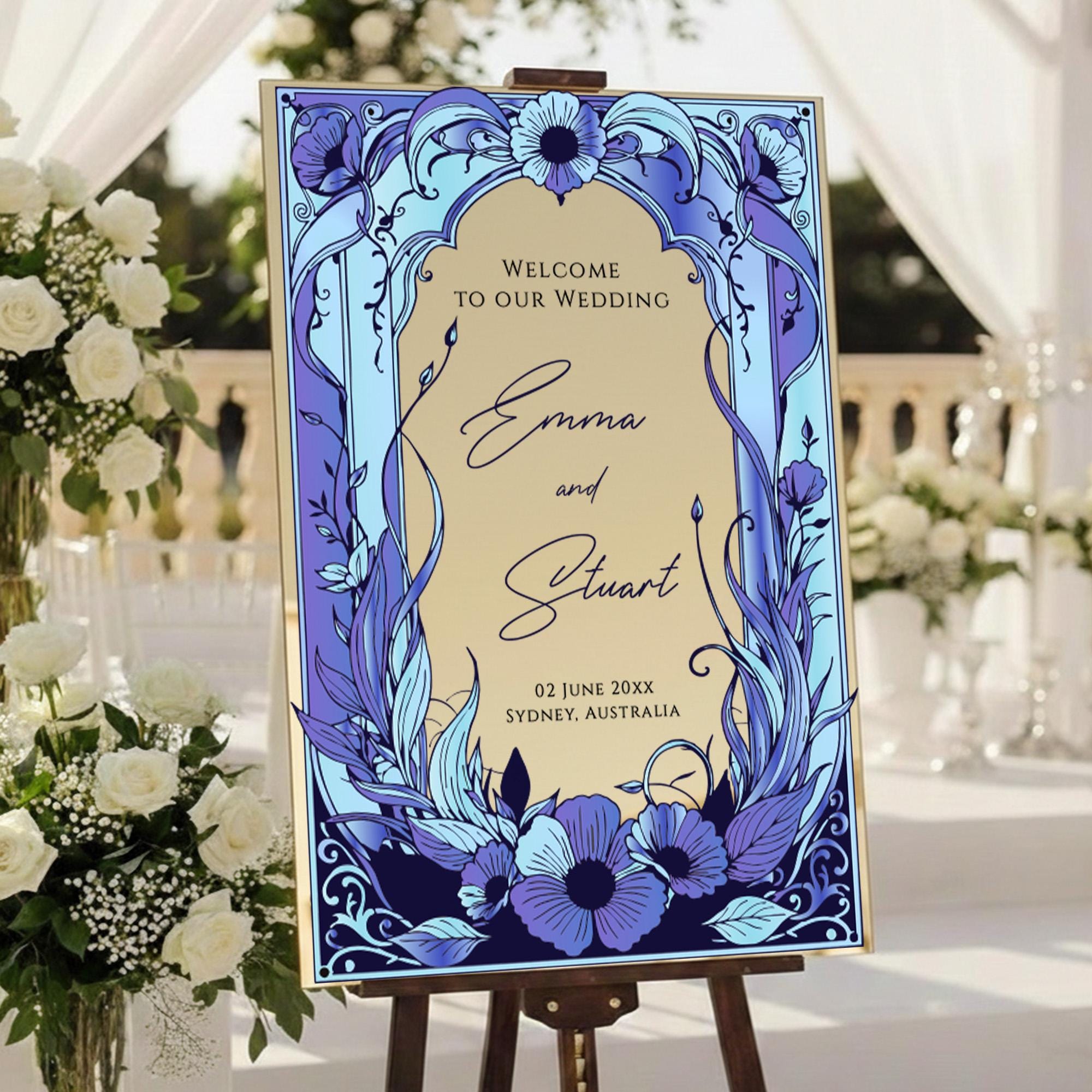 a wedding invitation sign with a floral design and text welcoming guests to the wedding of Emma and Stuart.