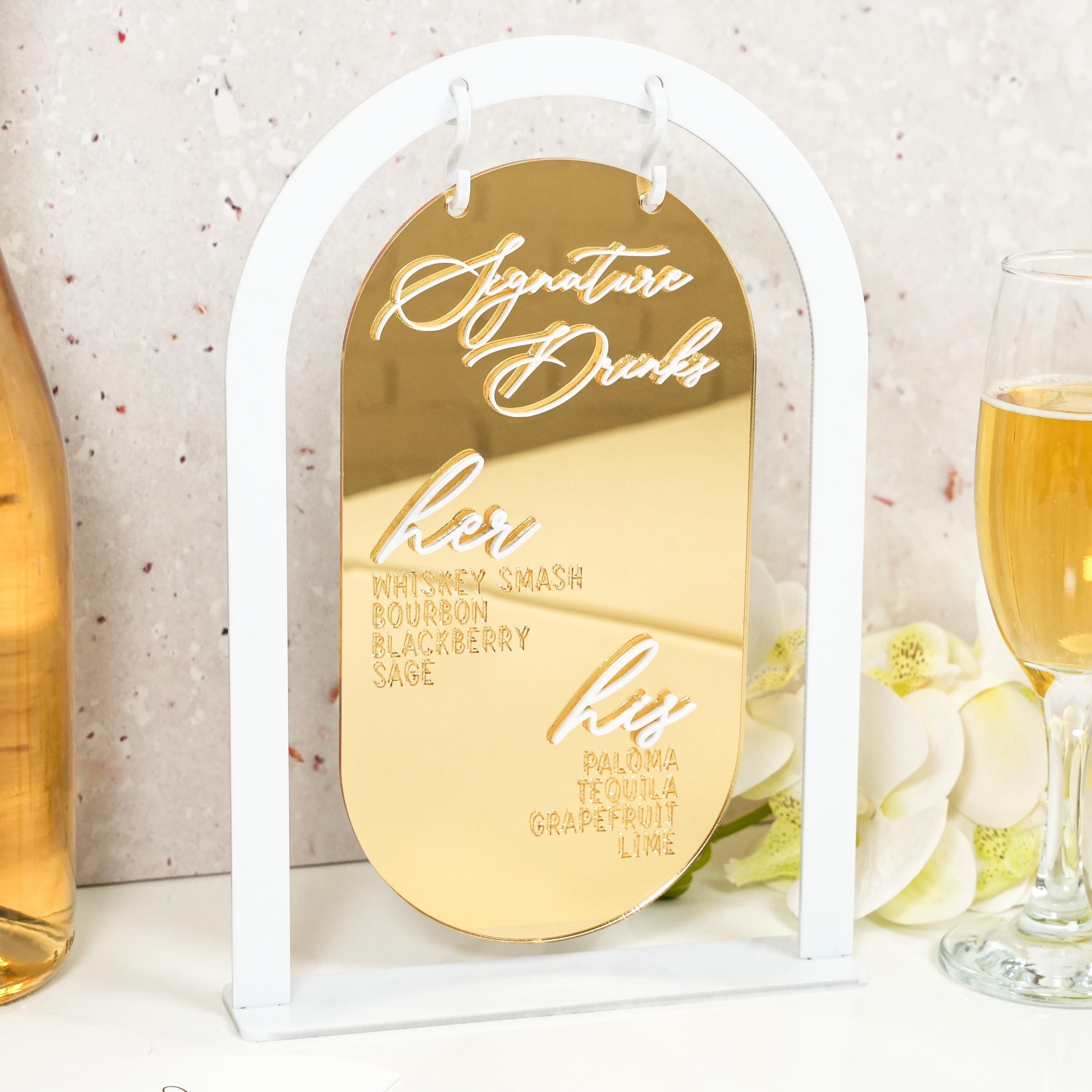 a glass of champagne and a bottle of wine on a table