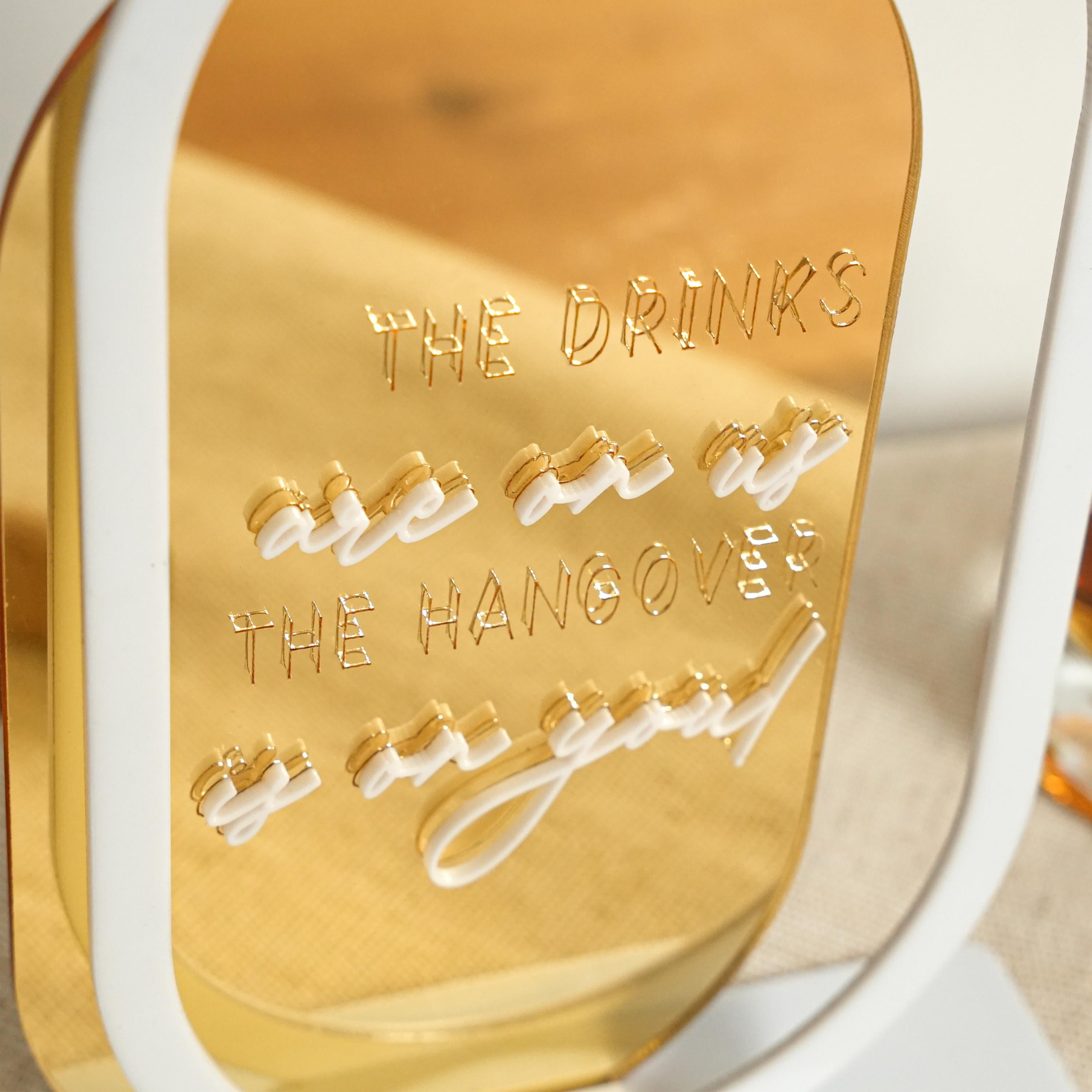 a close up of a gold and white chair