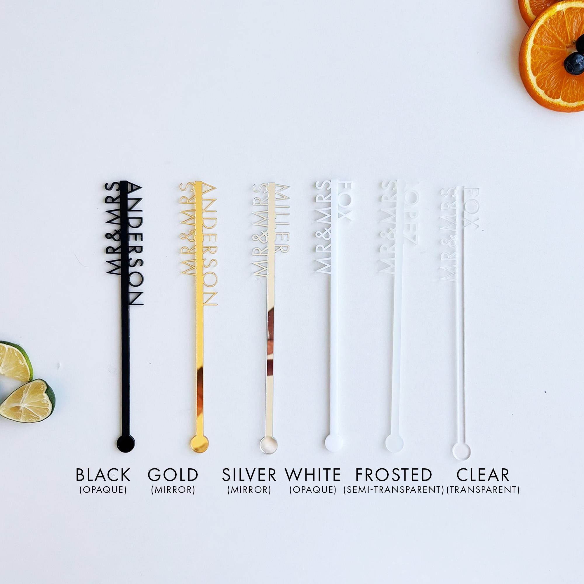 a white table topped with orange slices and black and white straws