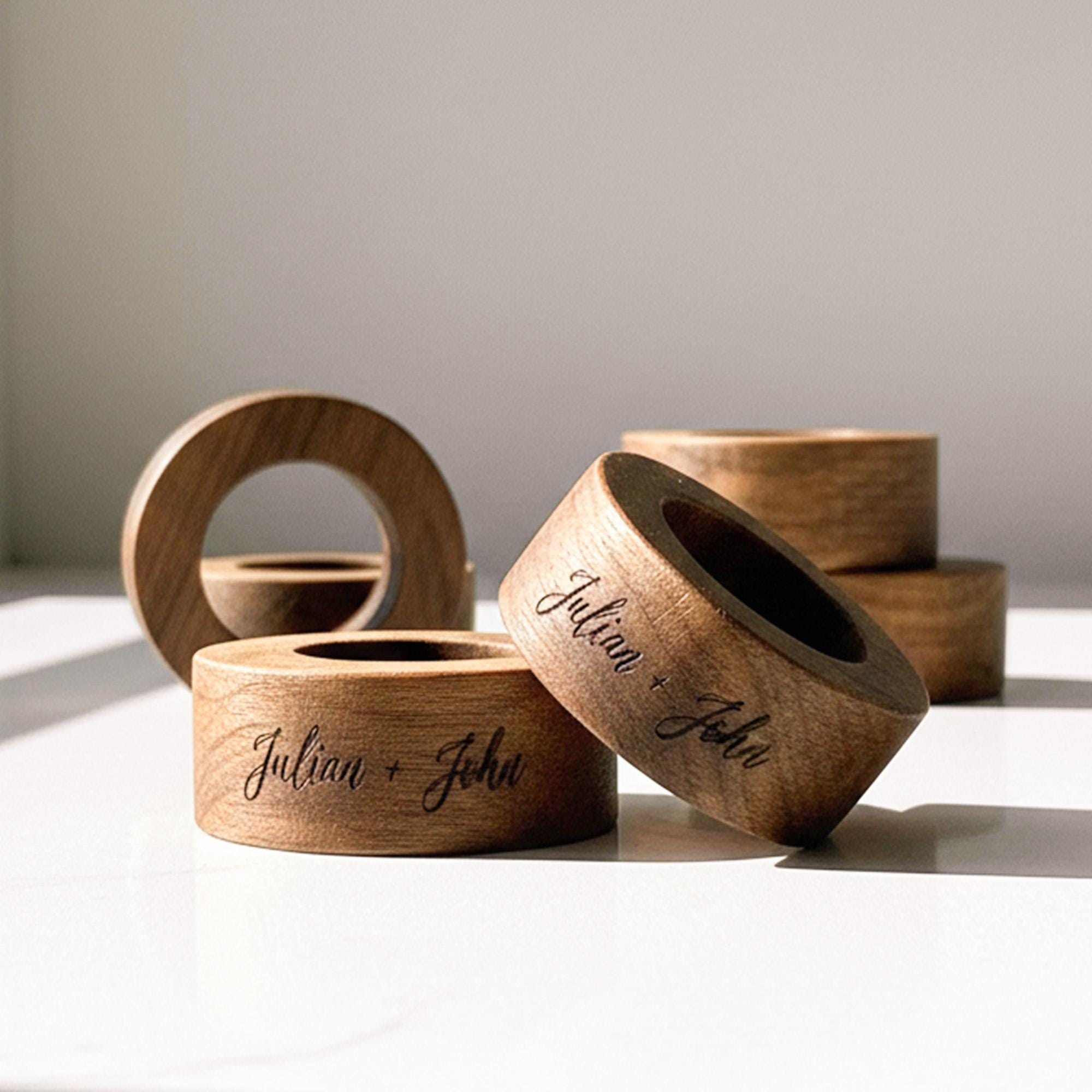 Handmade wooden napkin ring with personalized engraving, natural wood texture close-up