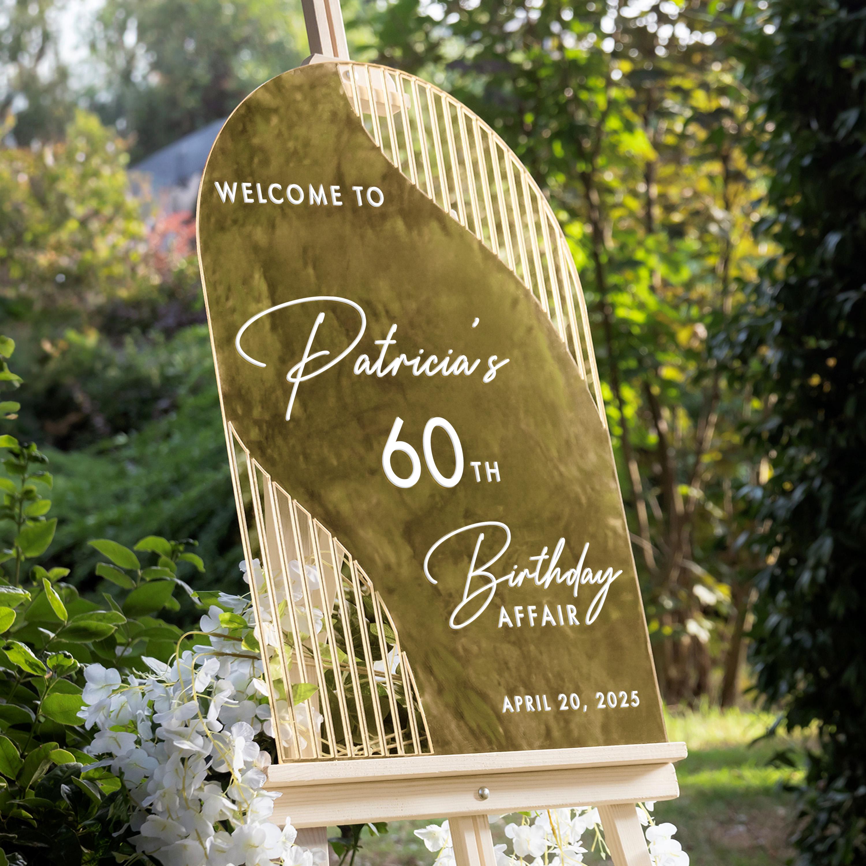 a sign that reads "Welcome to Patricia's 60th Birthday Affair" with the date "APRIL 20, 2025" below it.
